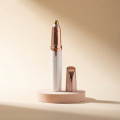 The Milara Brow Pen standing upright on a blush pedestal