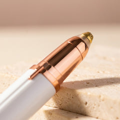 Close-up of the Milara Brow Pen's 360 degree gold precision trimming tip